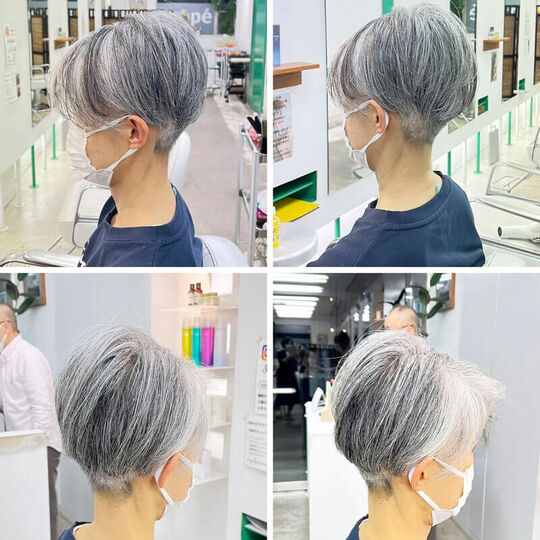 ショートボブで青い服の70代女性